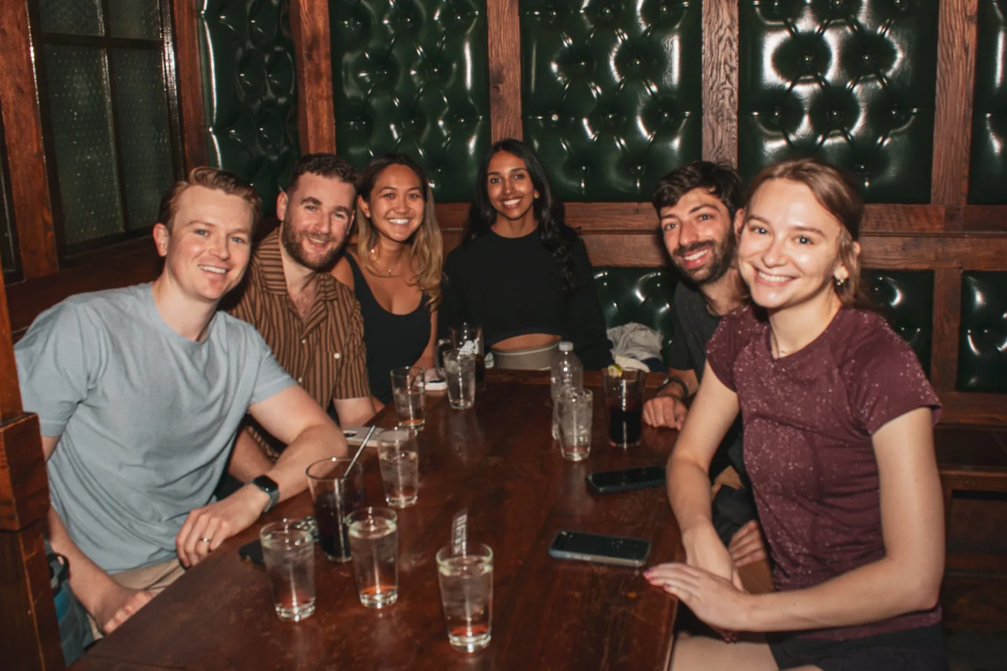Friends gathered around a table during the final