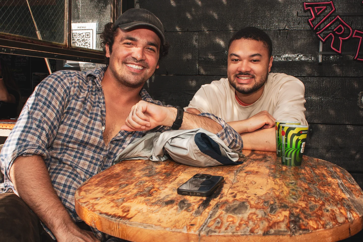 Two guests smiling at a table