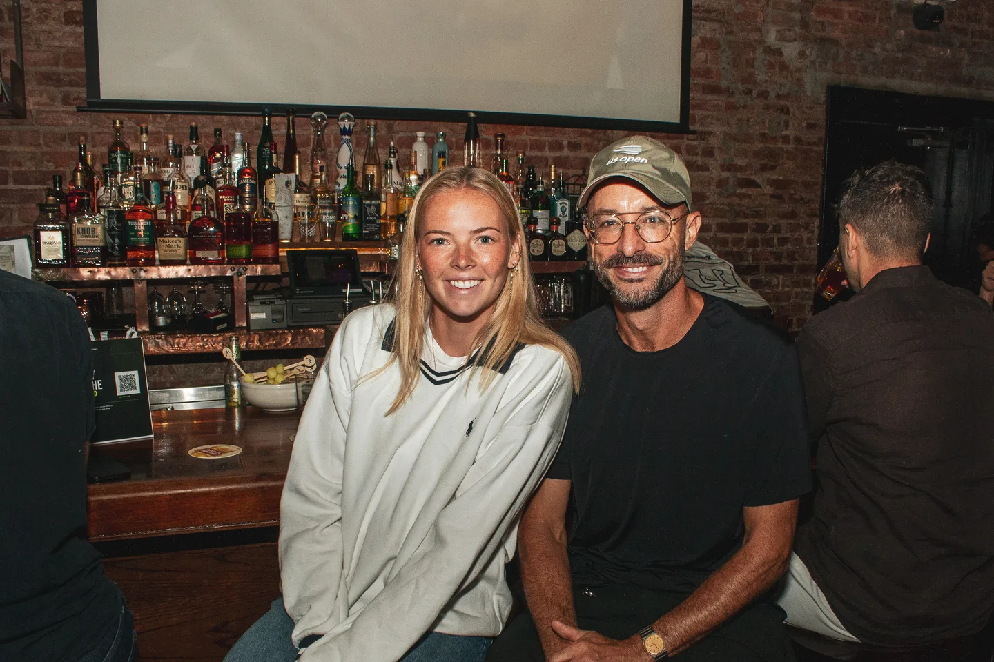 Guests posing at the Brass Monkey bar