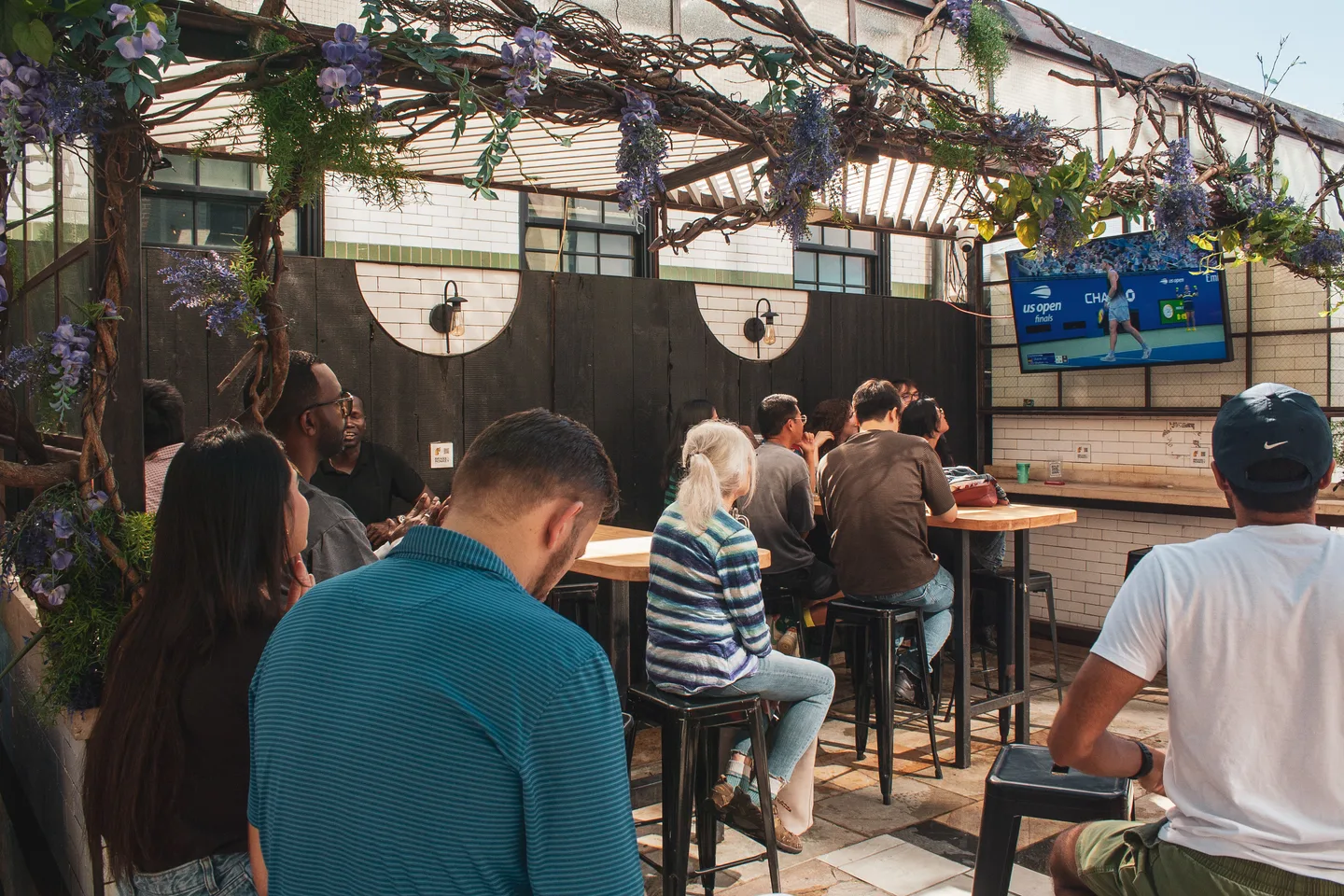 Guests watching the US Open men’s final on screen
