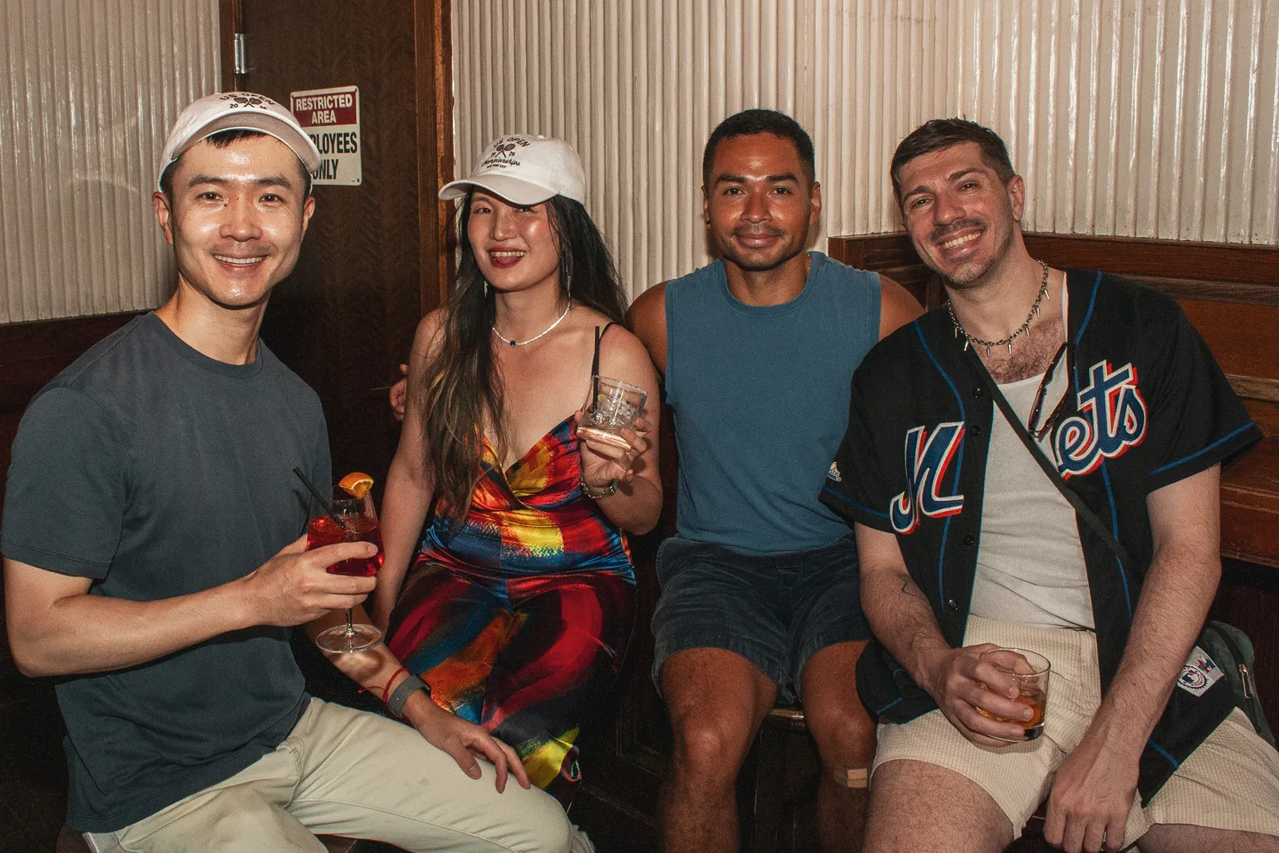 Four guests seated together at Brass Monkey