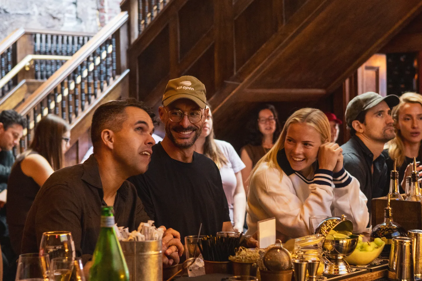 Guests enjoying the final at the bar