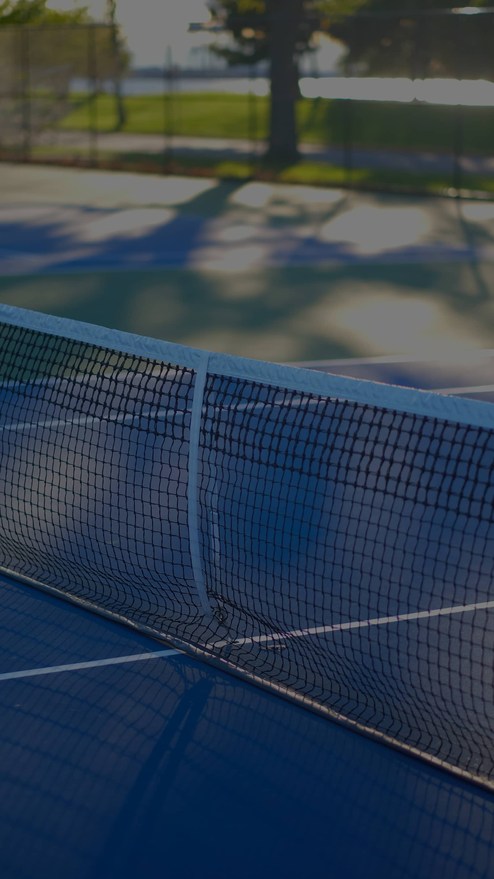 Tennis net on a sunlit New York City court