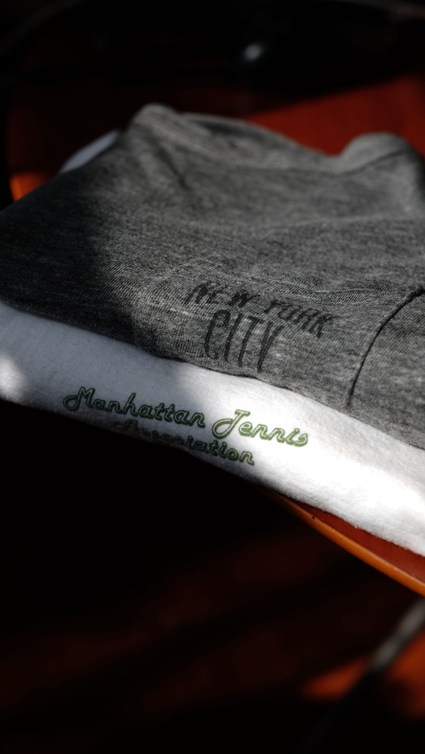 Manhattan Tennis Association apparel stacked together